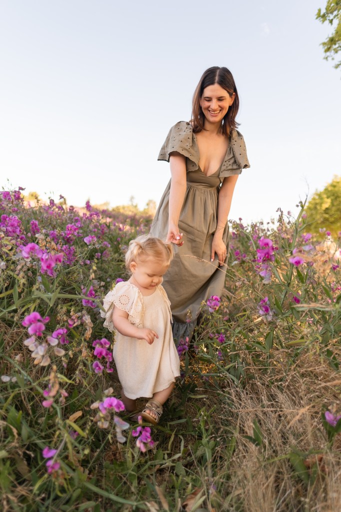 Mother and daughter in field of wildflowers in Seattle WA for a morning photography session